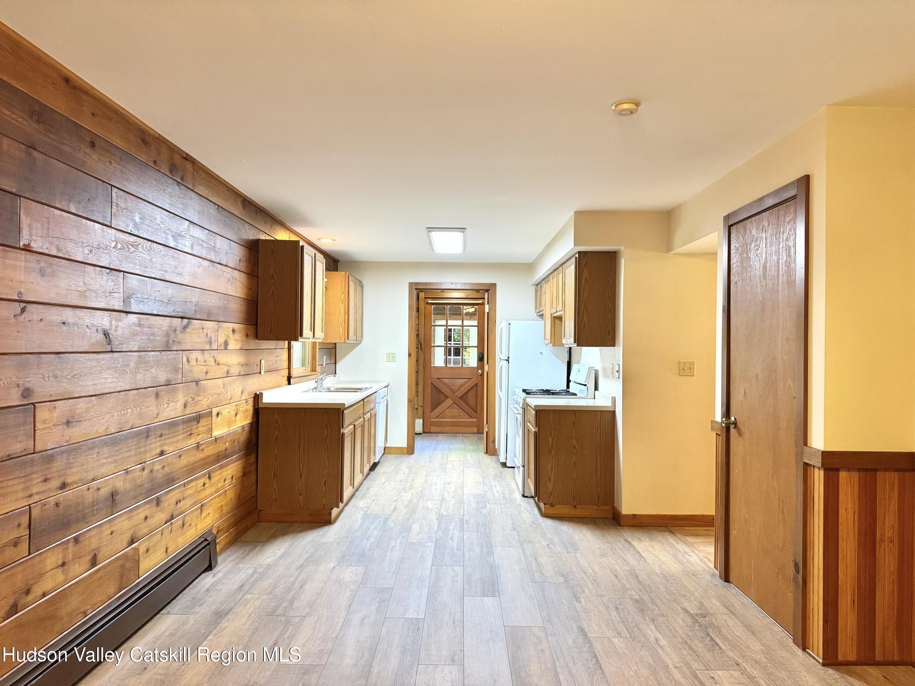 5 Will Palmer Road Catskill, NY 12414 - Photo 14 of 32 a kitchen with sink cabinets and wooden floor