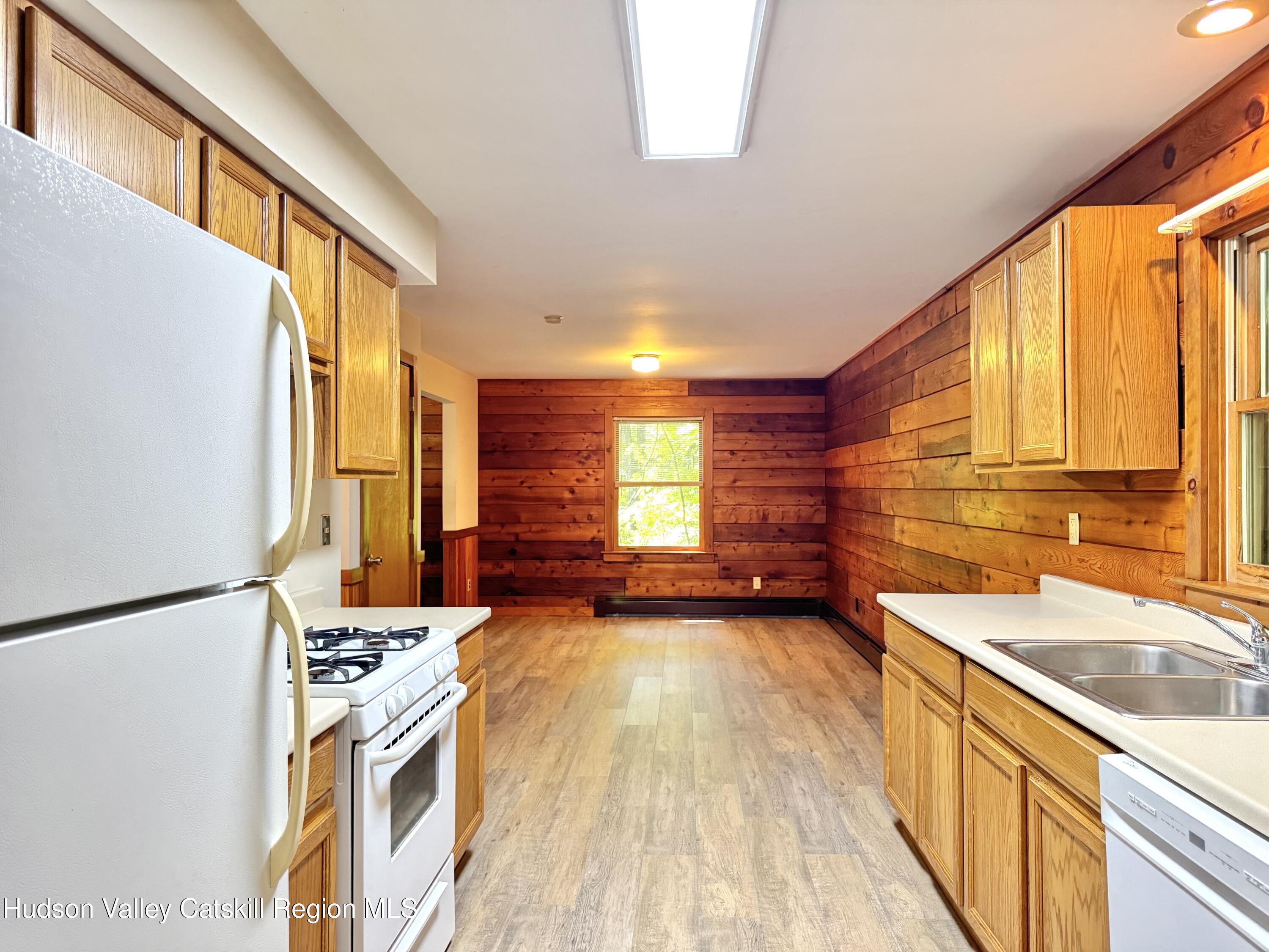 5 Will Palmer Road Catskill, NY 12414 - Photo 18 of 32 a view of a kitchen with a sink and wooden floor