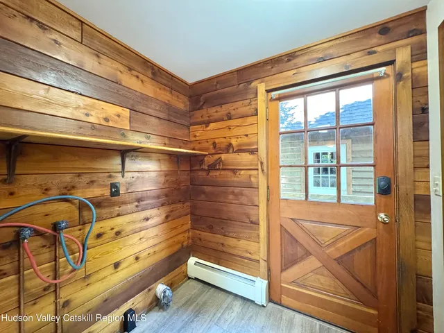a view of a room with wooden floor and windows