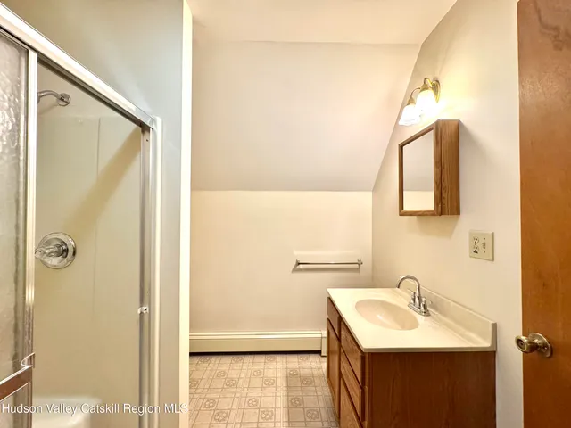 a bathroom with a sink and mirror