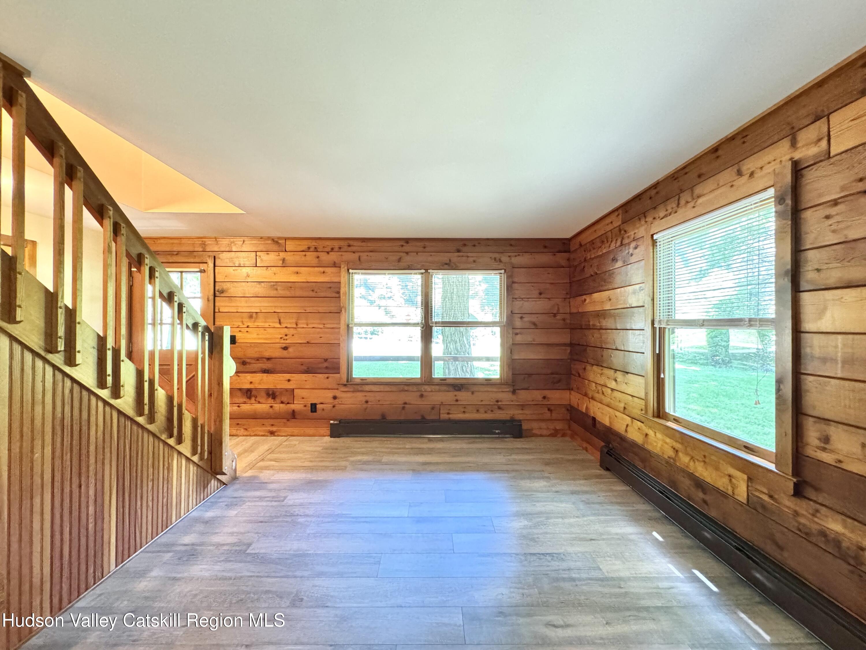 5 Will Palmer Road Catskill, NY 12414 - Photo 9 of 32 a view of an empty room with wooden floor and a window