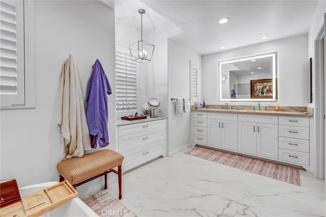 a room with a chair and a dresser