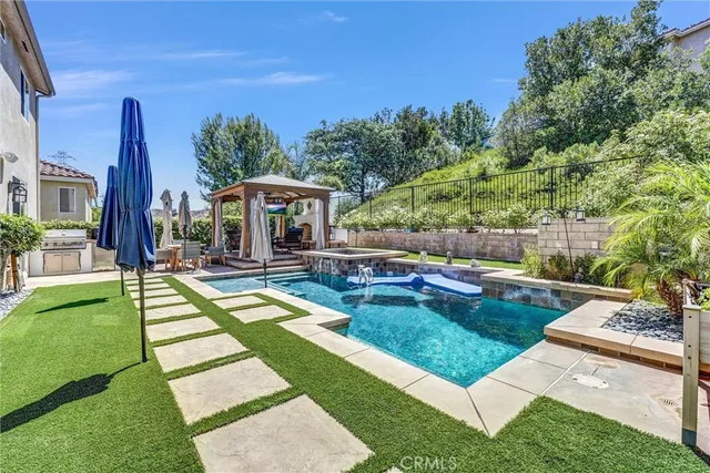 a view of a swimming pool with a patio