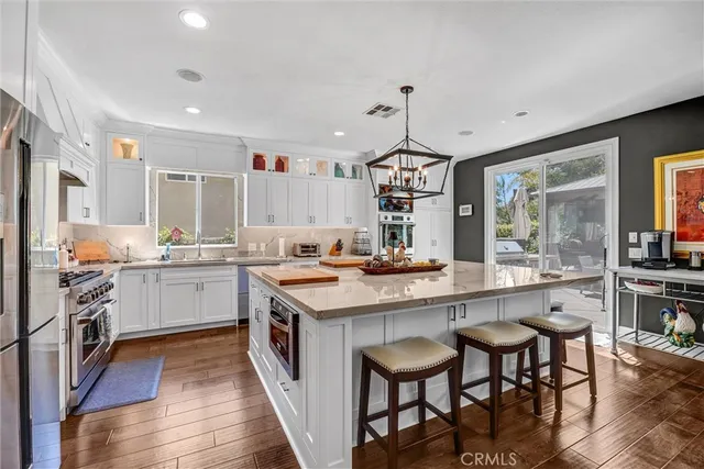 a kitchen with stainless steel appliances a sink and stove