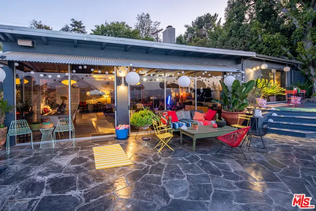 an outdoor space with lots of furniture