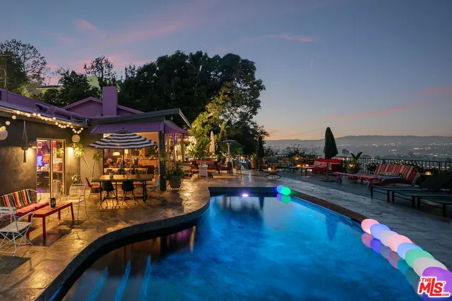 a view of swimming pool with outdoor seating