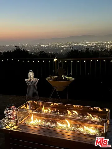 a view of a swimming pool and an outdoor seating