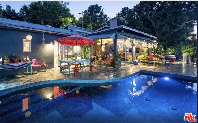 a view of swimming pool with outdoor seating