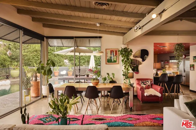 a very nice looking living room with furniture and a large window