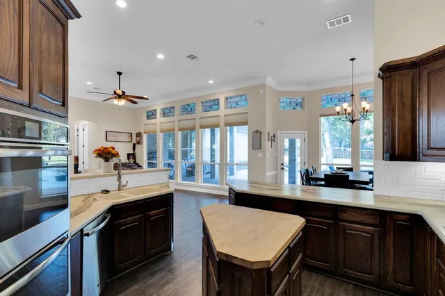 a kitchen with a sink stove and refrigerator