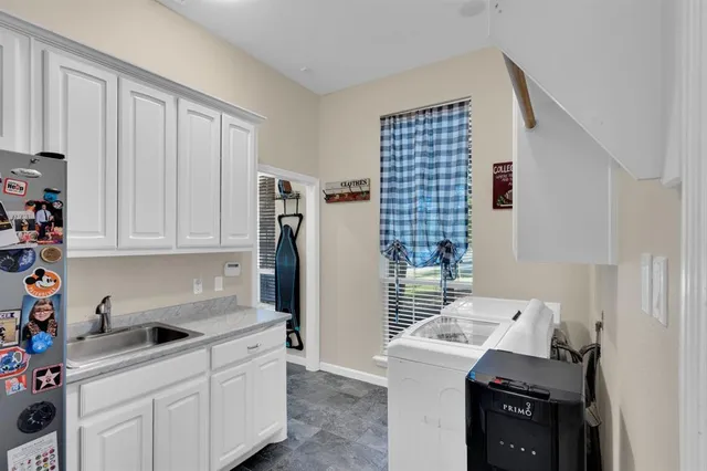 a kitchen with a stove and a refrigerator
