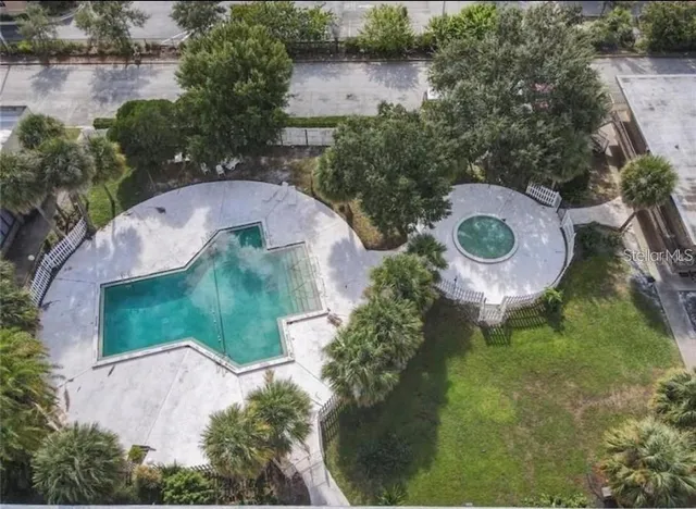 an aerial view of a swimming pool and outdoor space