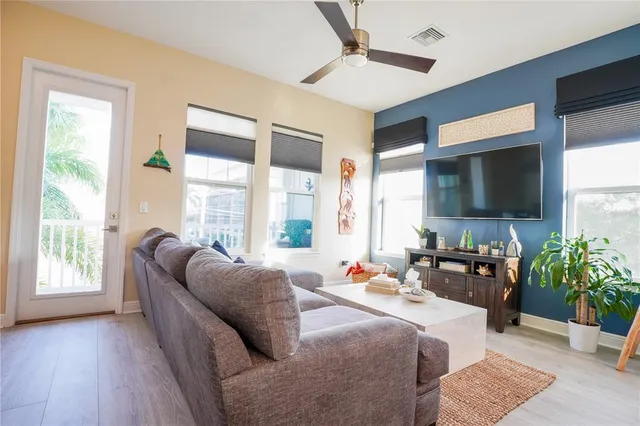 a kitchen with stainless steel appliances granite countertop a stove a refrigerator and a white cabinets