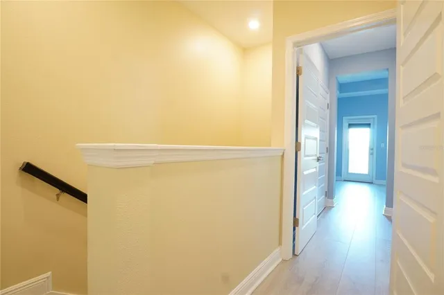 a bedroom with a large bed and a large window