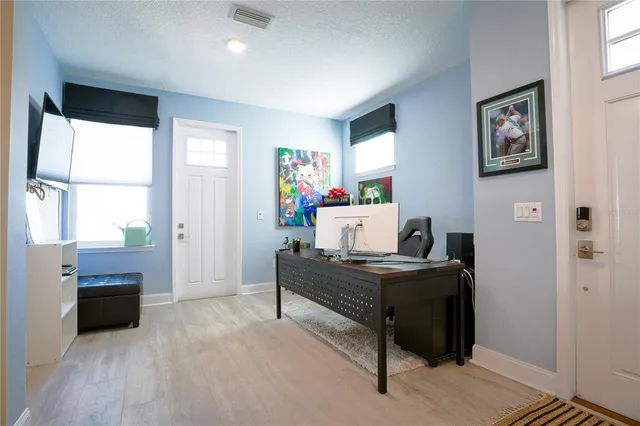 a room with furniture and a flat screen tv