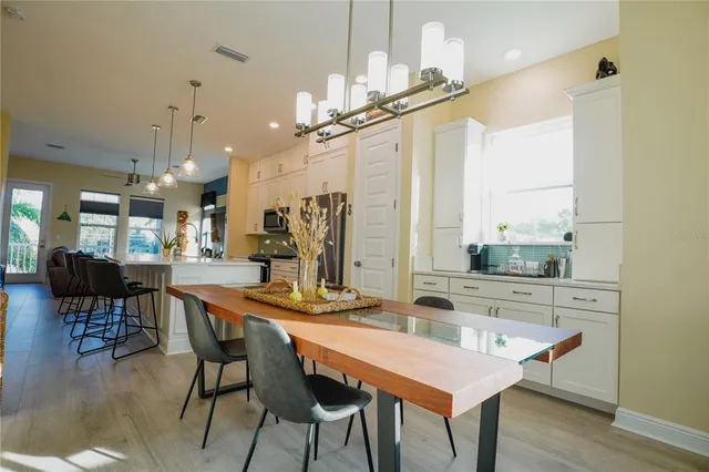 a view of a workspace with furniture and window
