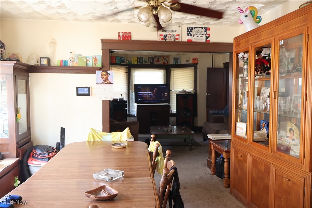 13519 Ashburton Road Cleveland, OH 44110 - Photo 11 of 12 Carpeted dining space with ceiling fan