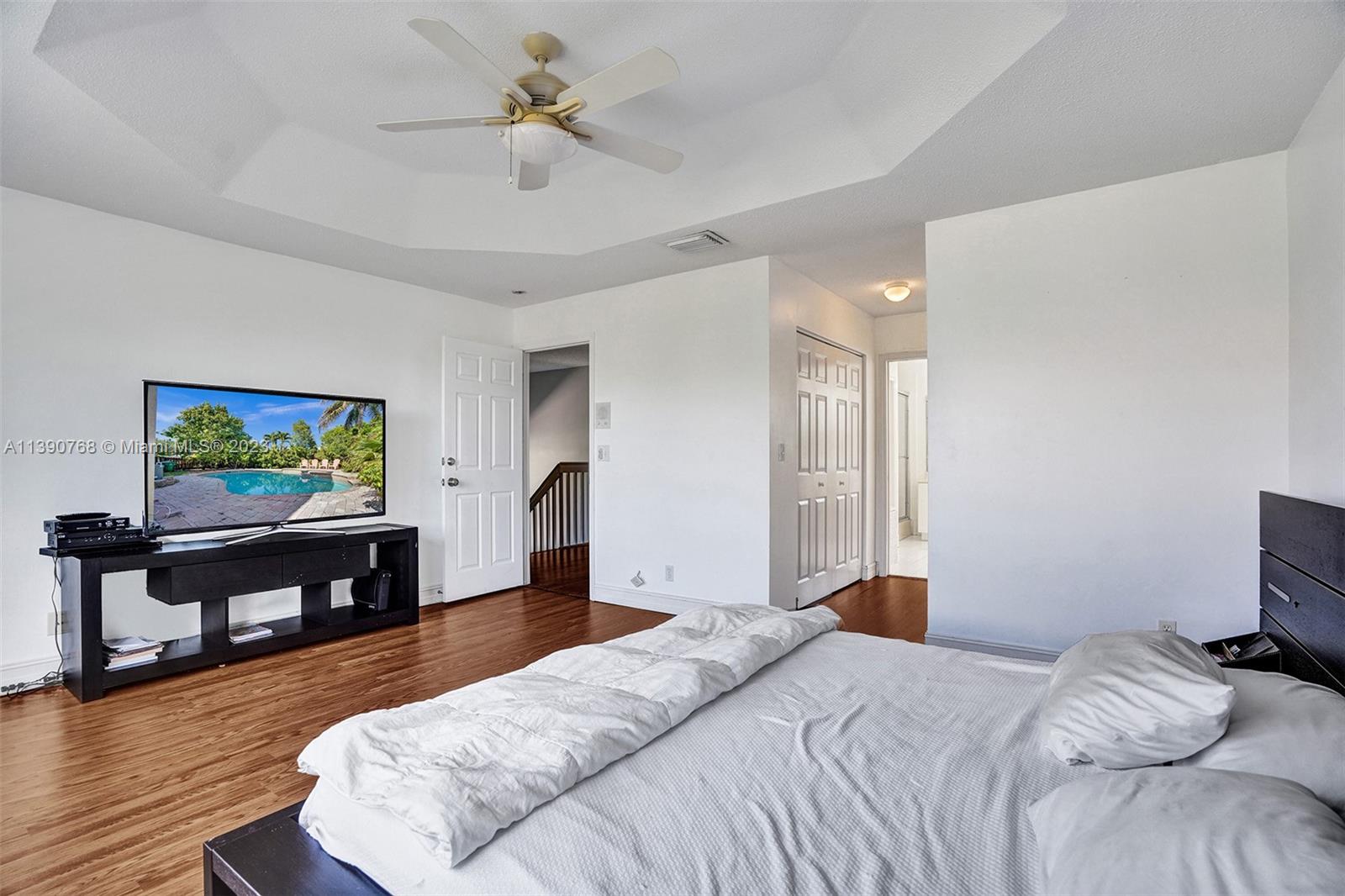Silver Shores Miramar, FL 33027 - Photo 6 of 30 a bedroom with a bed and a flat screen tv