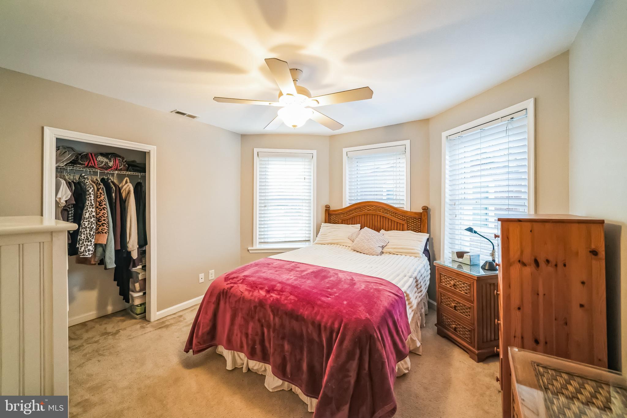 59 Cherry Street Hatfield, PA 19440 - Photo 19 of 30 a bedroom with a bed and a chandelier