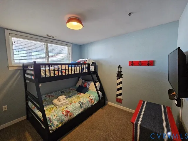 a bed room with a bed and a window