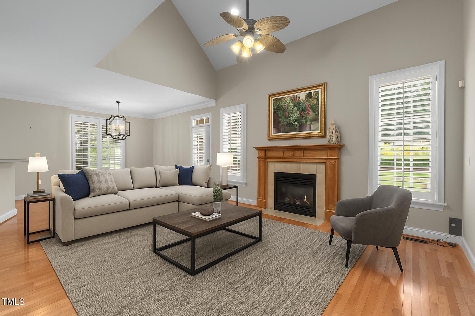 1012 Coram Fields Road Wake Forest, NC 27587 - Photo 14 of 38 a living room with furniture and a fireplace