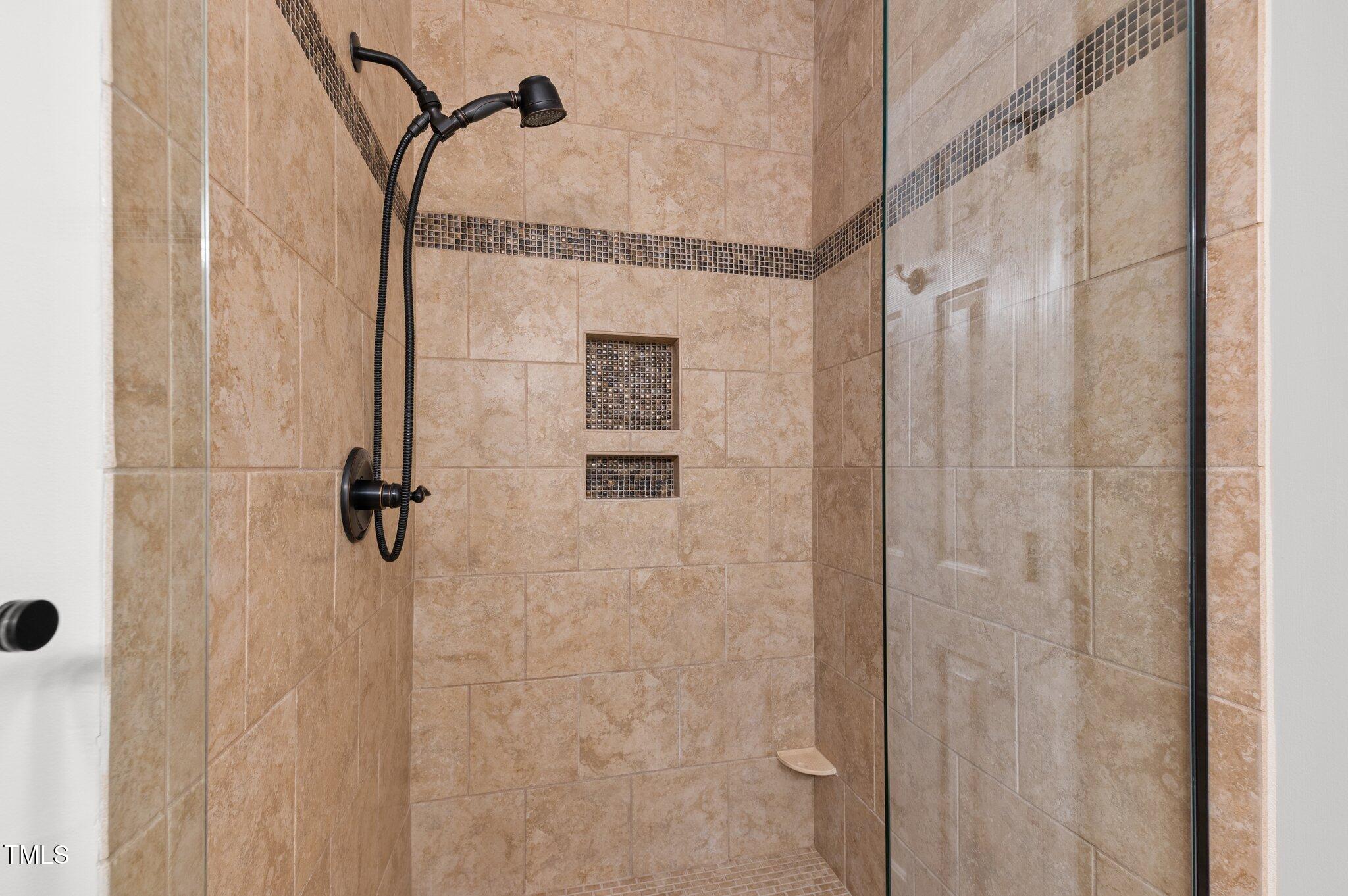1012 Coram Fields Road Wake Forest, NC 27587 - Photo 20 of 38 a bathroom with a shower