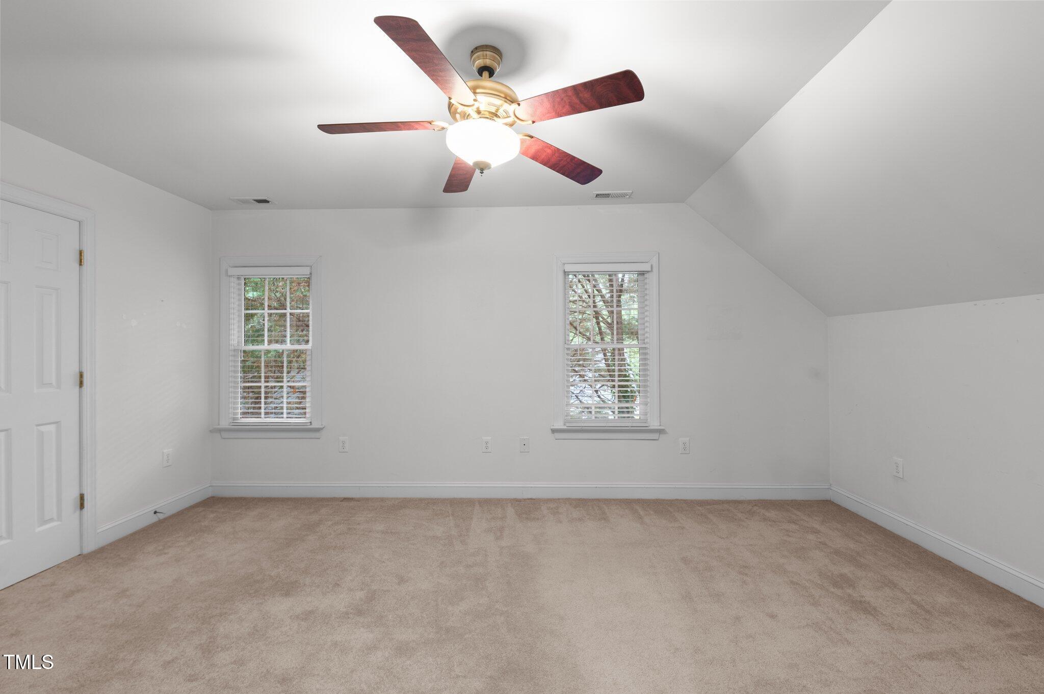 1012 Coram Fields Road Wake Forest, NC 27587 - Photo 25 of 38 an empty room with ceiling fan and window