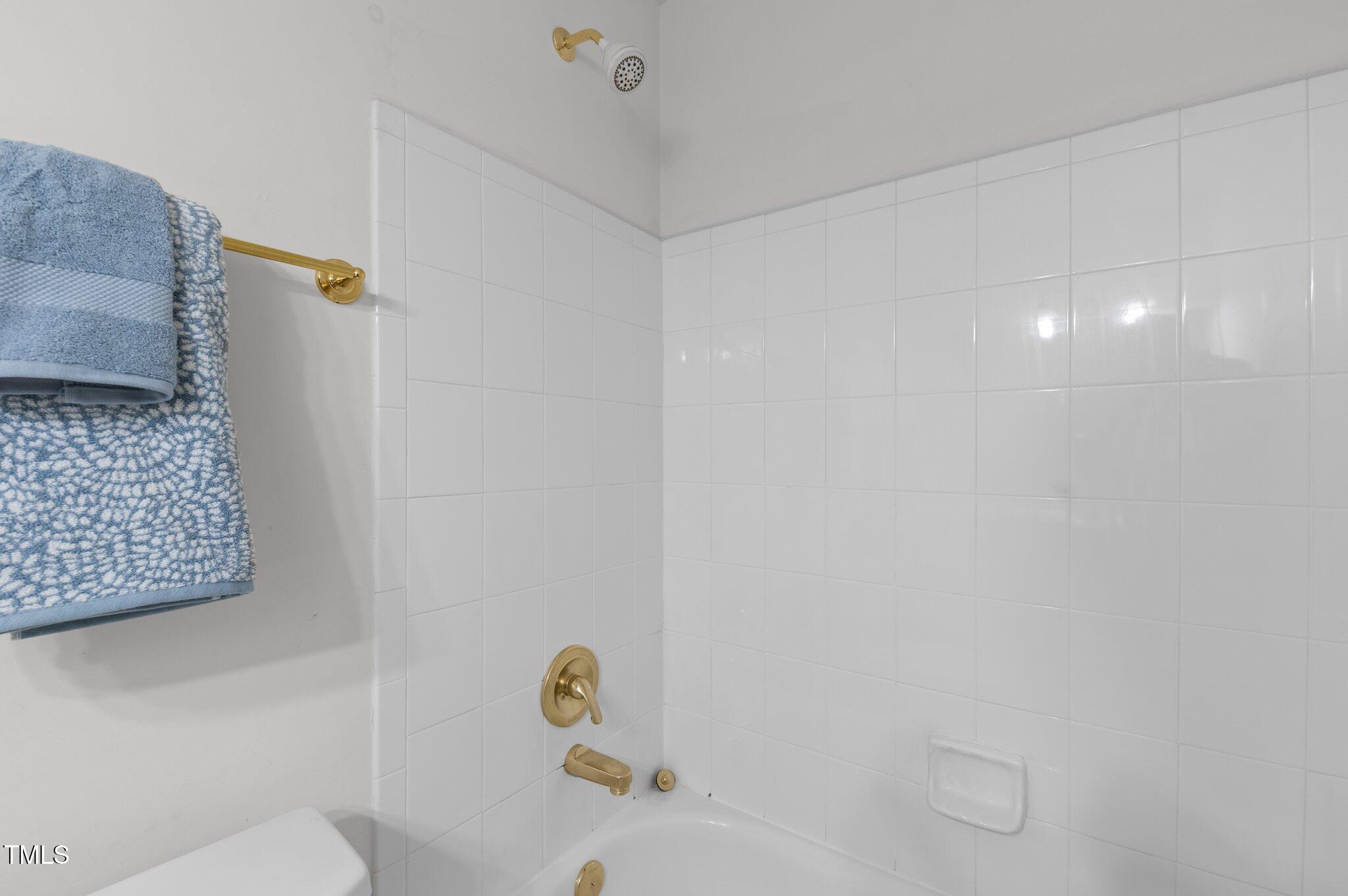 1012 Coram Fields Road Wake Forest, NC 27587 - Photo 27 of 38 a bathroom with a shower