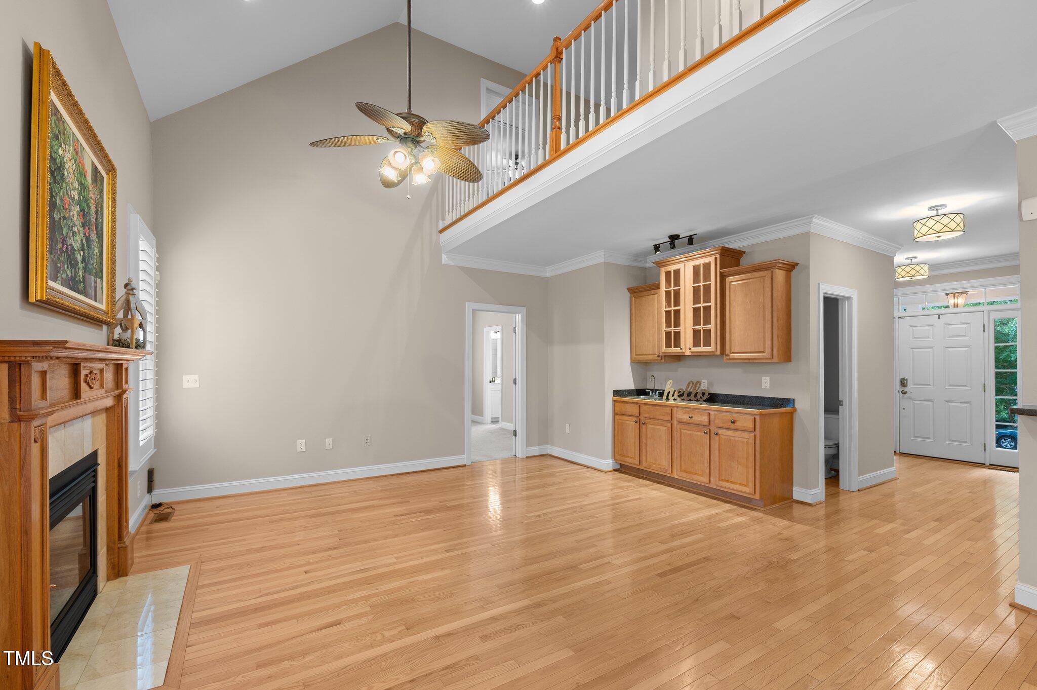 1012 Coram Fields Road Wake Forest, NC 27587 - Photo 6 of 38 a living room with stainless steel appliances kitchen island granite countertop furniture and a fireplace