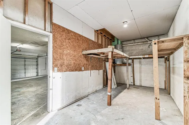 a view of a room with wooden floor and a window