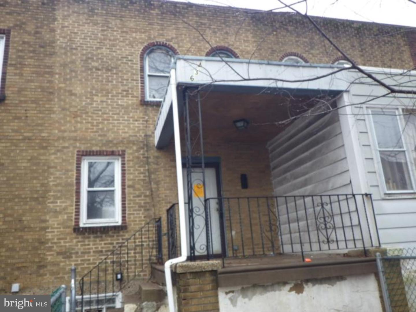 634 Littlecroft Road Upper Darby, PA 19082 - Photo 1 of 9 a view of a house with a door and wooden fence