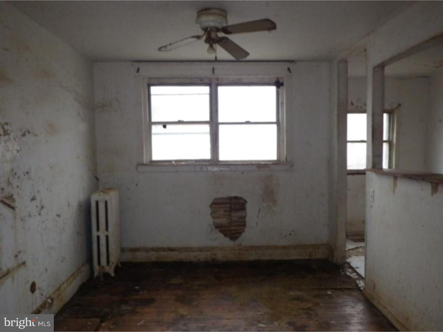 634 Littlecroft Road Upper Darby, PA 19082 - Photo 3 of 9 a room with window and a wooden door