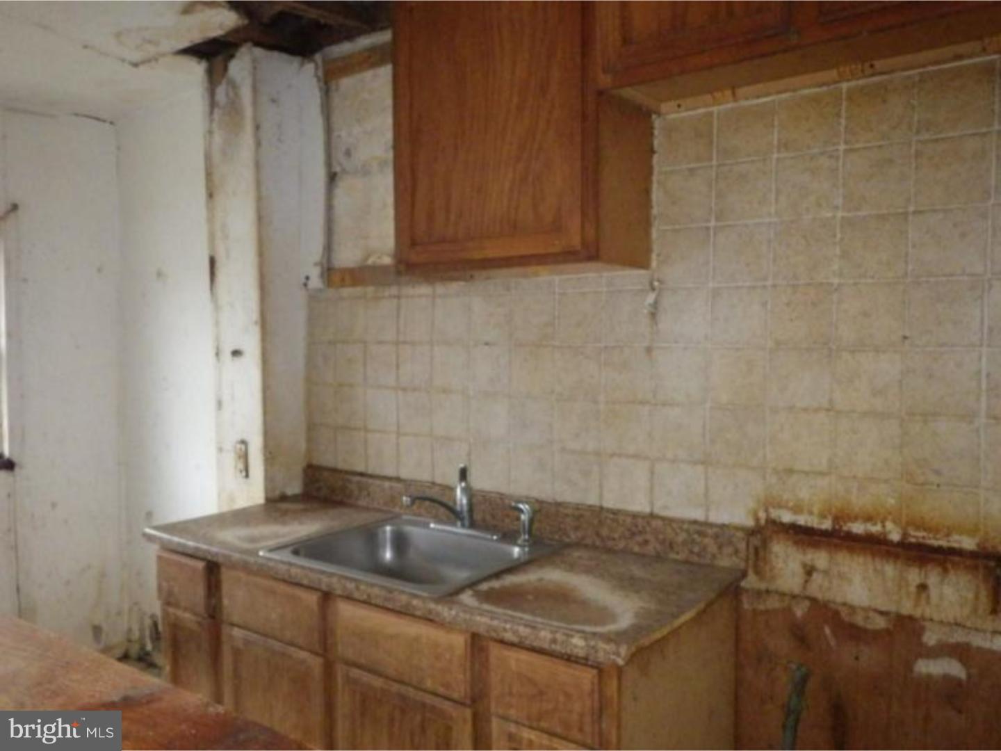 634 Littlecroft Road Upper Darby, PA 19082 - Photo 4 of 9 a bathroom with a sink and a mirror