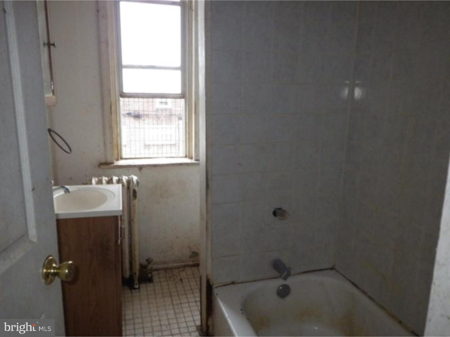634 Littlecroft Road Upper Darby, PA 19082 - Photo 7 of 9 a bathroom with a sink and tub