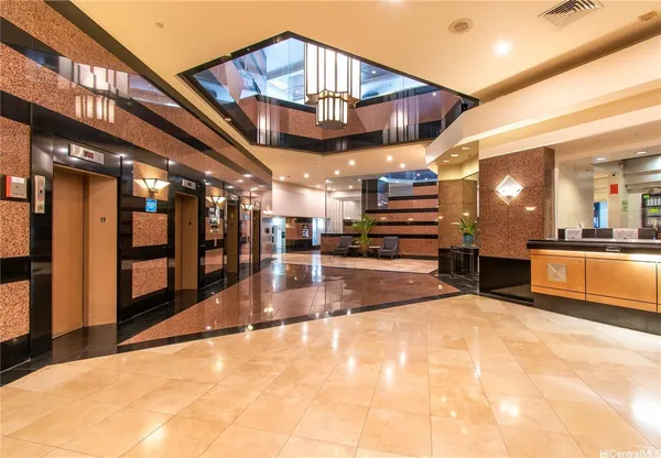 a view of a lobby with black carpet