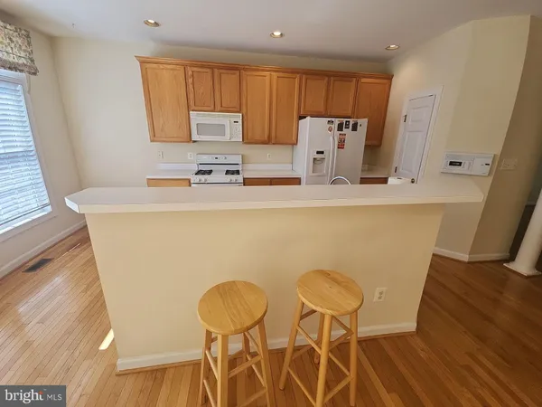 a view of balcony with wooden floor