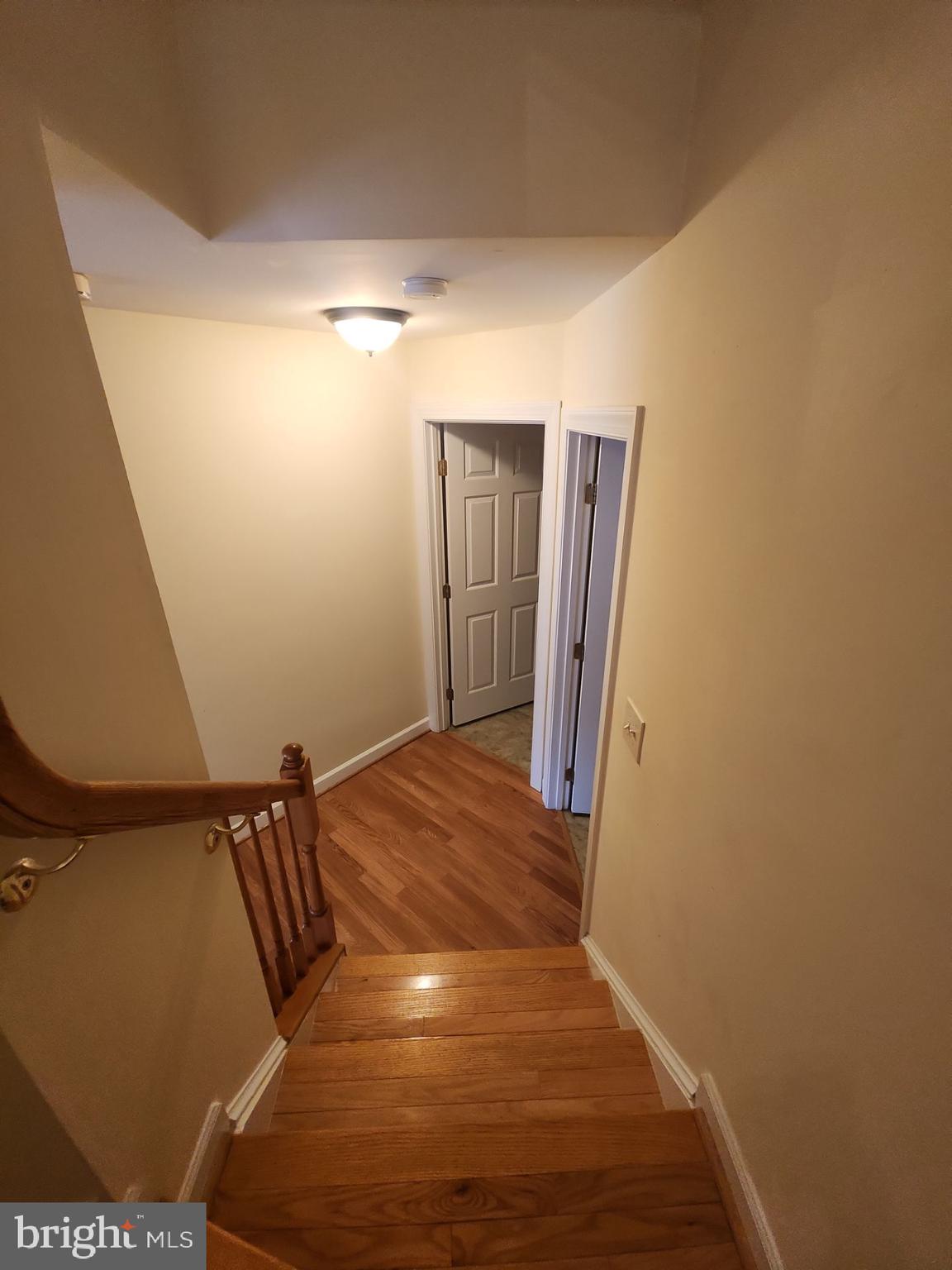 6681 Debra Lu Way Springfield, VA 22150 - Photo 23 of 57 a view of a hallway with wooden floor
