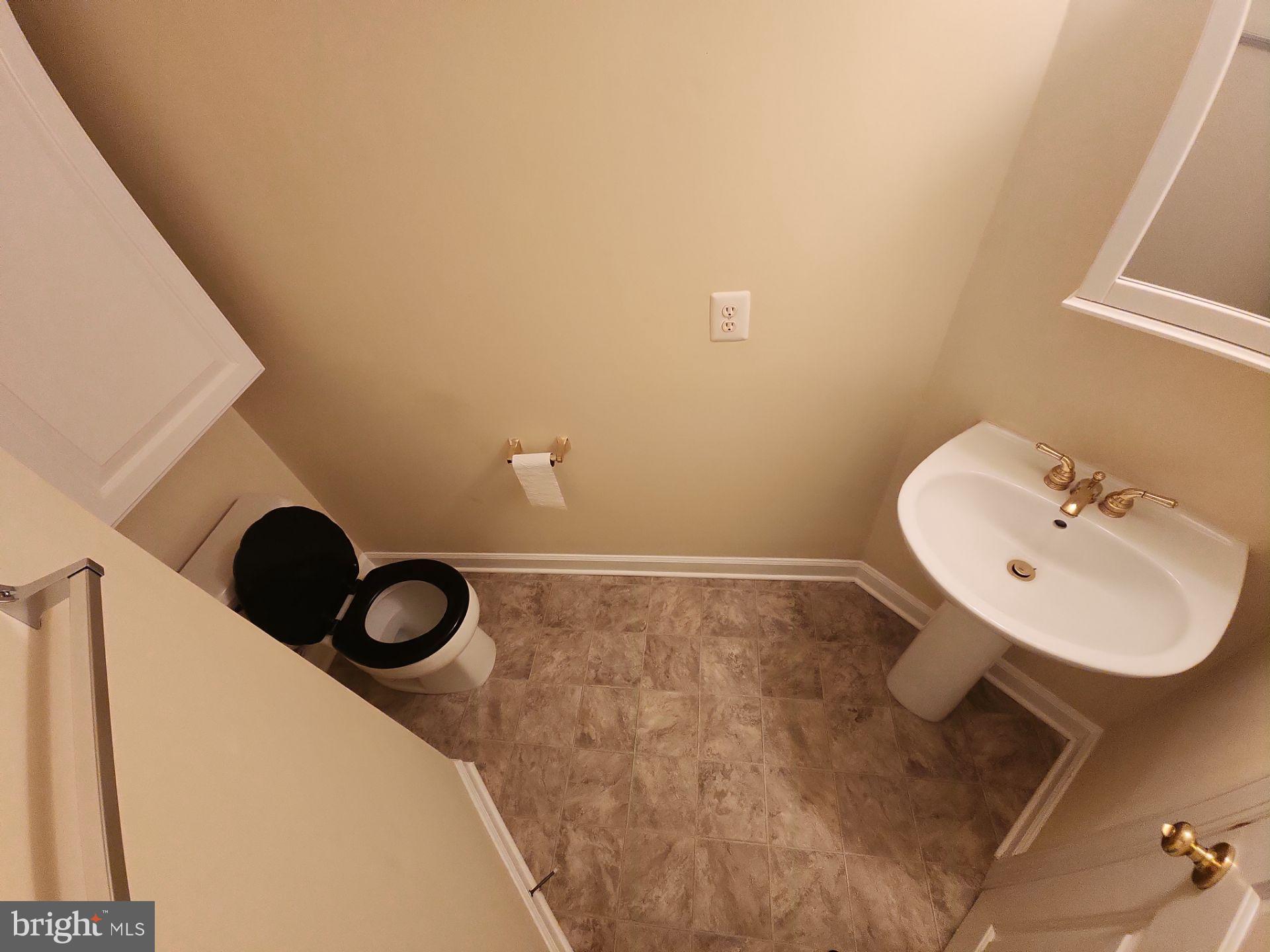 6681 Debra Lu Way Springfield, VA 22150 - Photo 26 of 57 a bathroom with a sink and a mirror