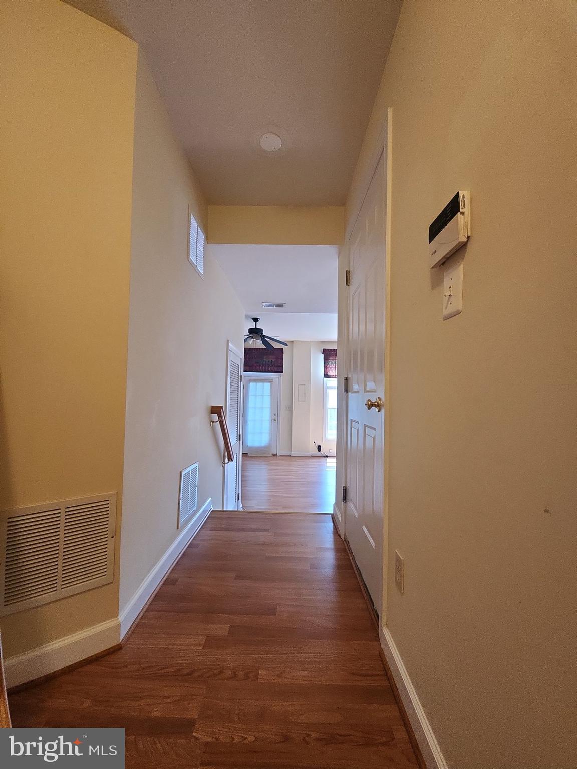 6681 Debra Lu Way Springfield, VA 22150 - Photo 29 of 57 a view of a hallway with wooden floor
