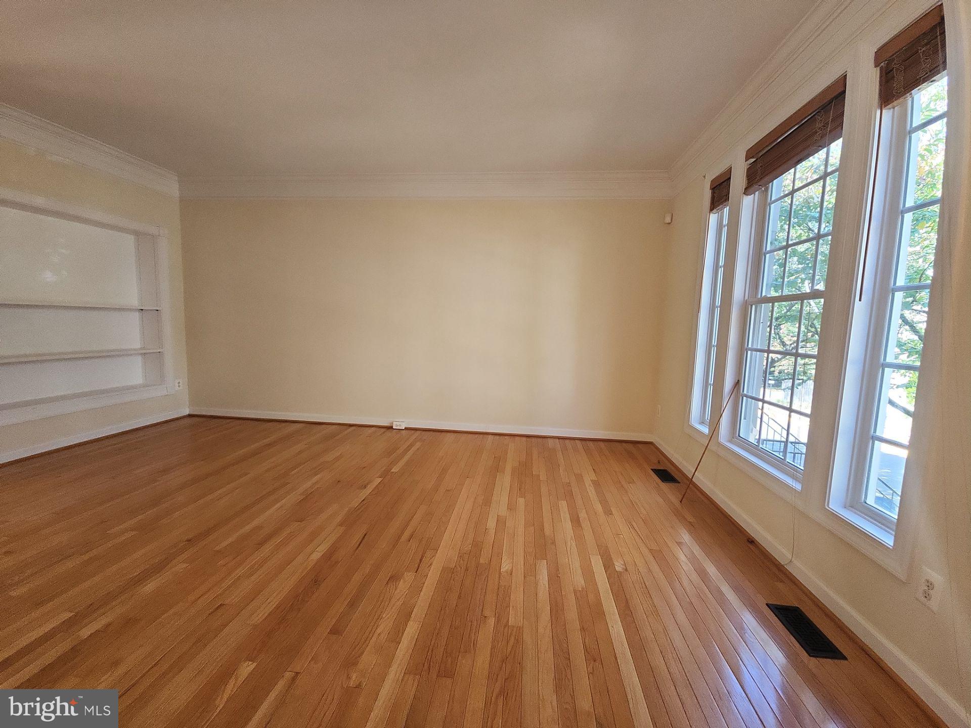 6681 Debra Lu Way Springfield, VA 22150 - Photo 3 of 57 wooden floor in an empty room with a window