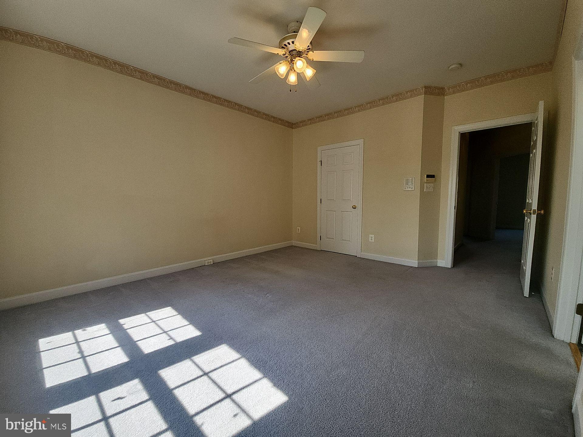 6681 Debra Lu Way Springfield, VA 22150 - Photo 42 of 57 wooden floor in an empty room with a window