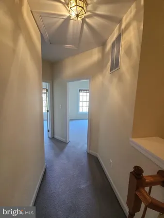 a bathroom with a sink a mirror and toilet