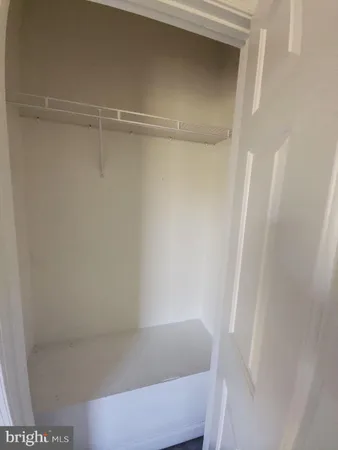 a view of a room with racks on the wall