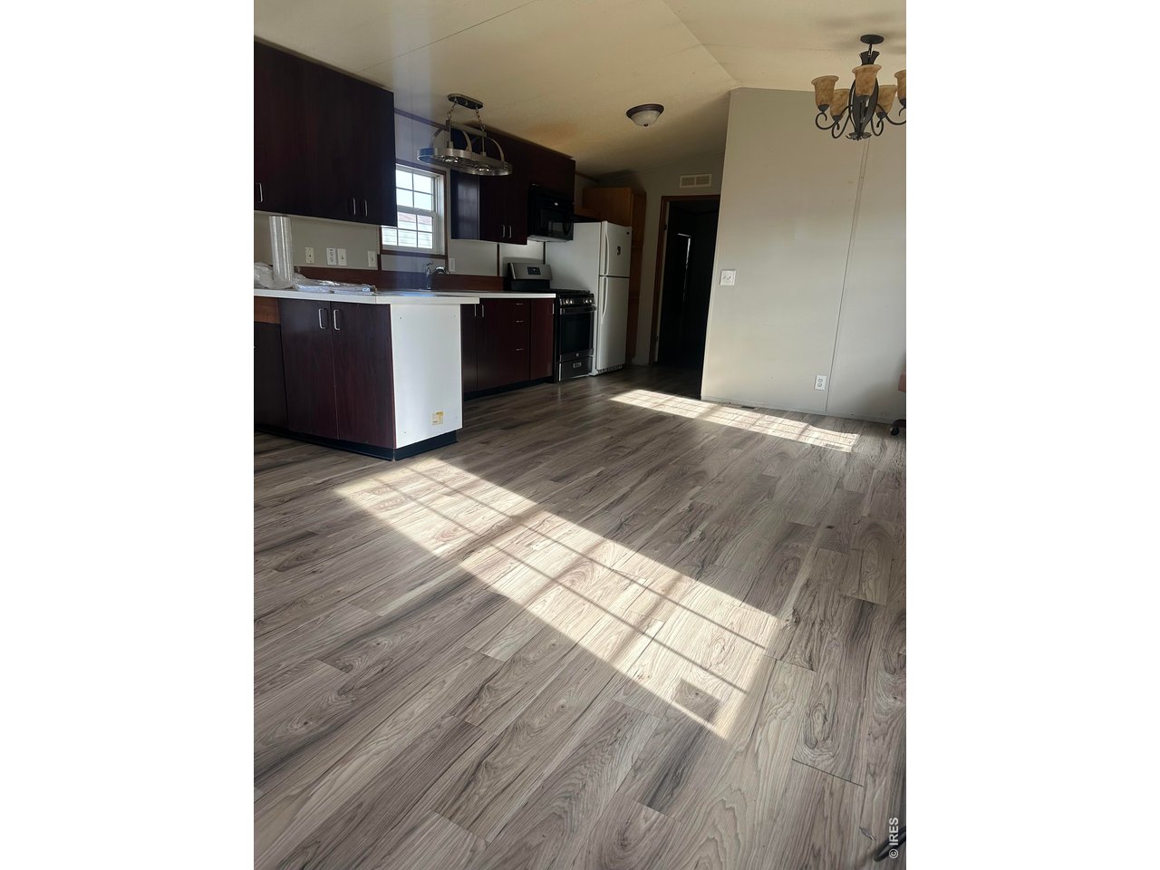 17190 Mt Vernon Road, Unit 3 Golden, CO 80401 - Photo 2 of 10 a view of a kitchen from the hallway