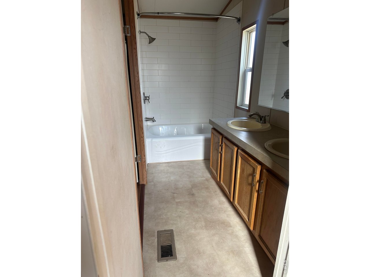 17190 Mt Vernon Road, Unit 3 Golden, CO 80401 - Photo 7 of 10 a view of a bathroom with a sink and a mirror