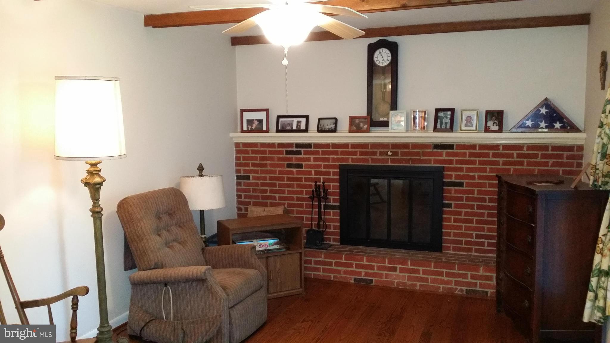 2448 Appleton Road Elkton, MD 21921 - Photo 17 of 29 a living room with furniture and a fireplace