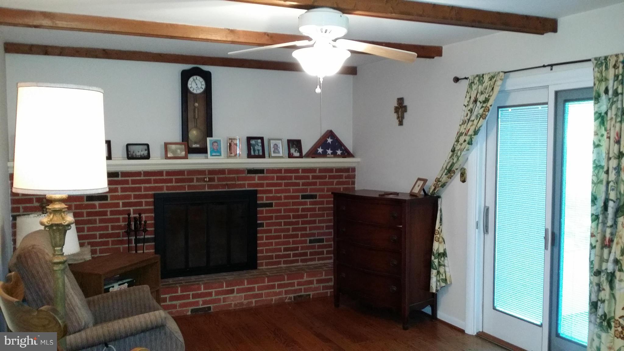 2448 Appleton Road Elkton, MD 21921 - Photo 18 of 29 a living room with furniture and a fireplace