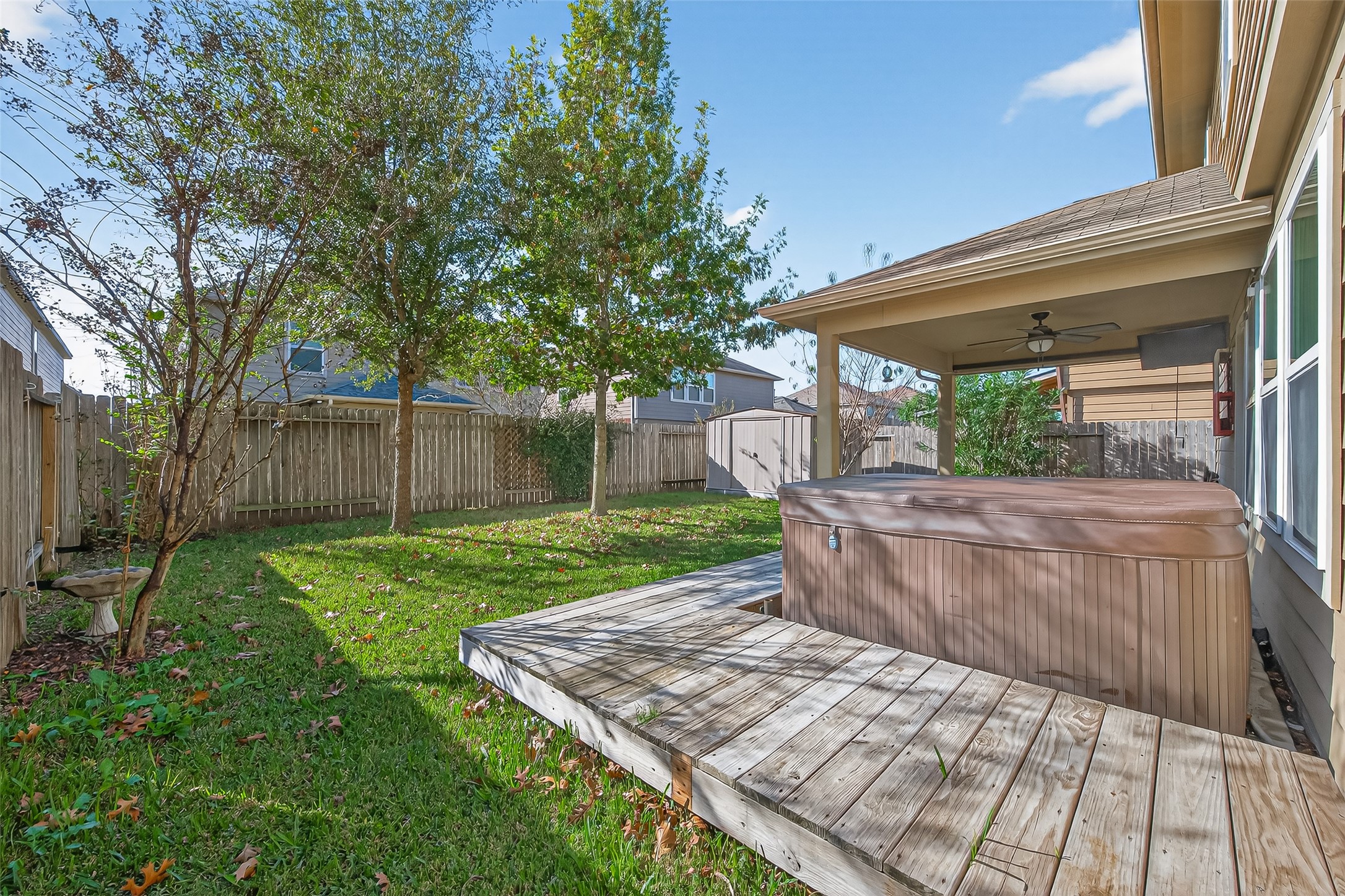 9940 Swallow Drive Conroe, TX 77385 - Photo 28 of 30 Deck built around hot tub with custom bar top table with towel hooks.