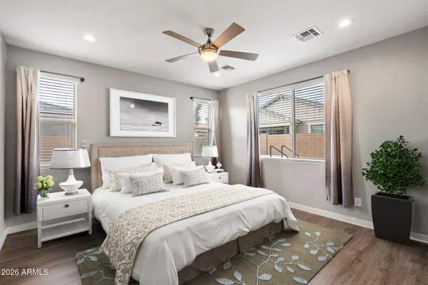 a bedroom with a large bed and a window