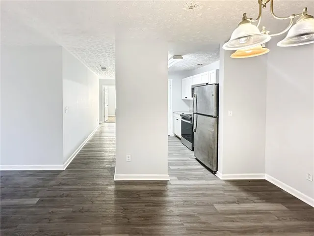 a view of a kitchen from the hallway